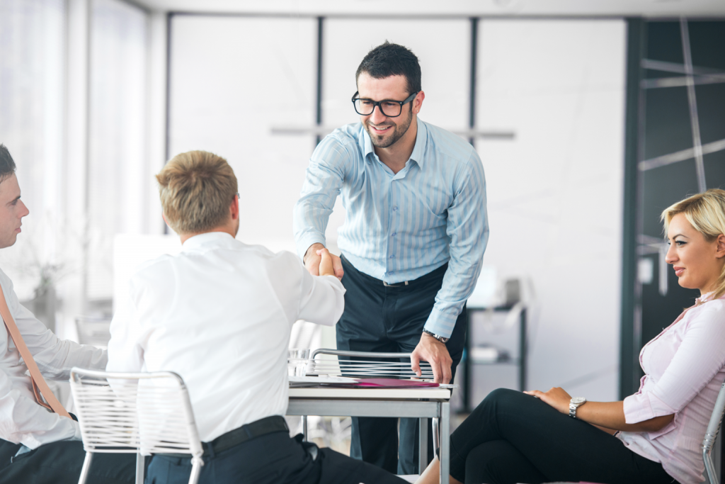 business-people-shaking-hands-on-a-company-meeting_HtxpxnRVj